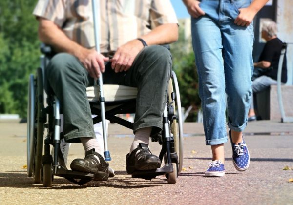 carer and client walking together